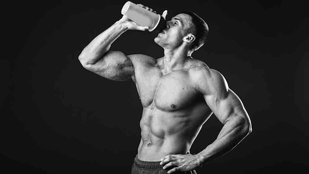 Protein Powder man drinking protein shake