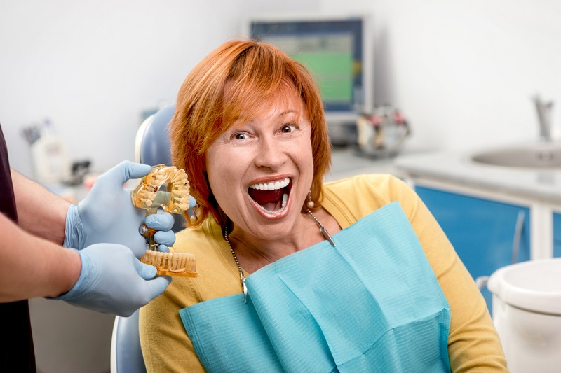 Denture Implants redhead smiling